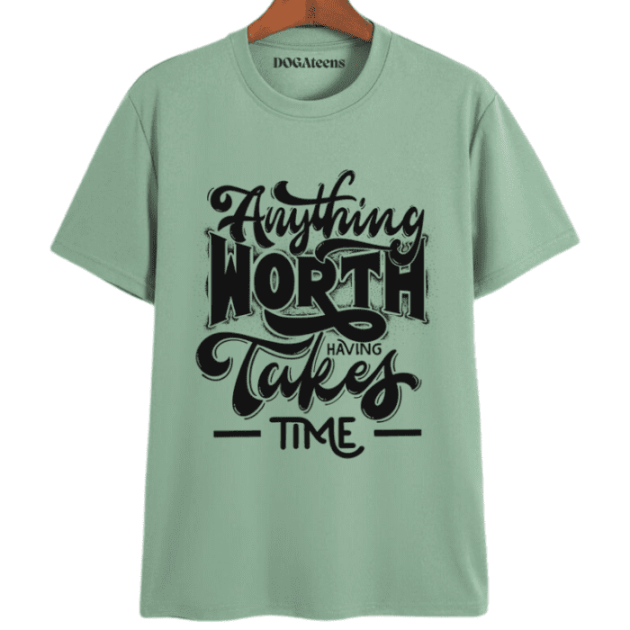 A Sage Green T-Shirt With A Colourful Text